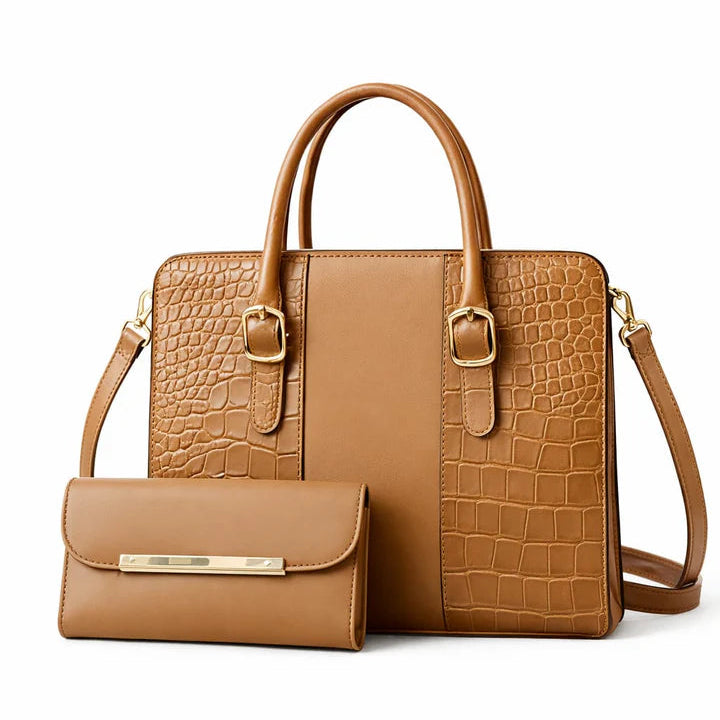 Brown crocodile-patterned handbag with matching wallet on a white background